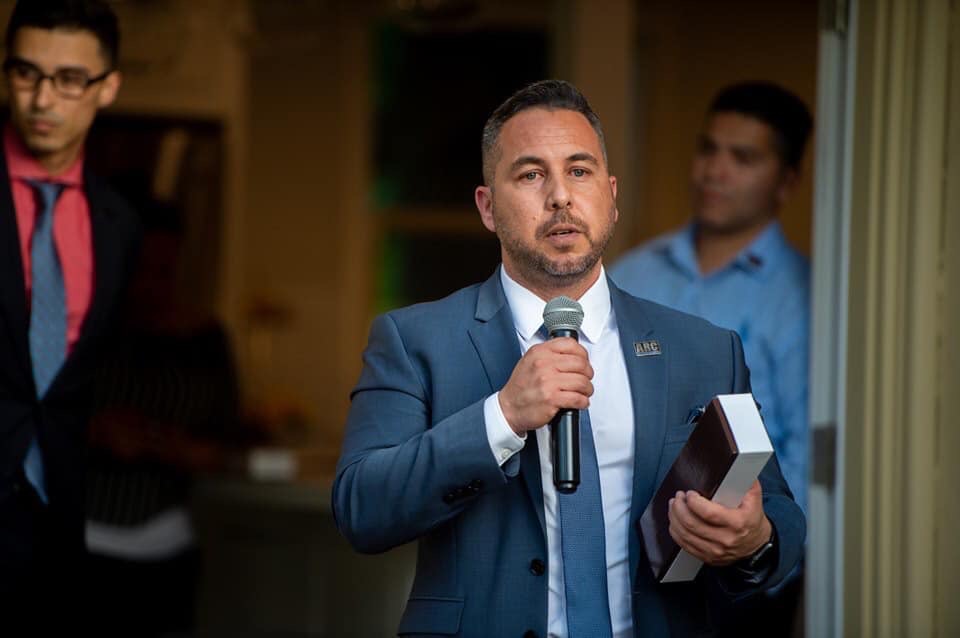 Michael Mendoza speaking at event